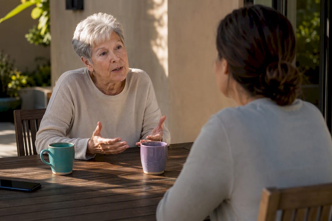 Senior and caregiver discussing monitoring consent