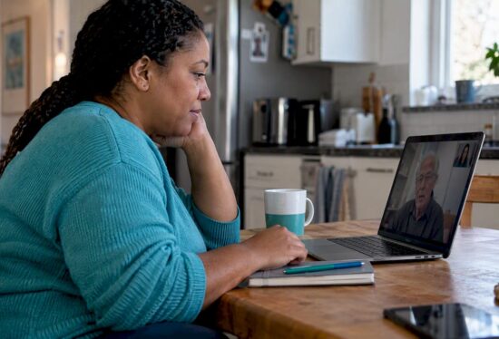 Family conducting a long distance caregiving meeting