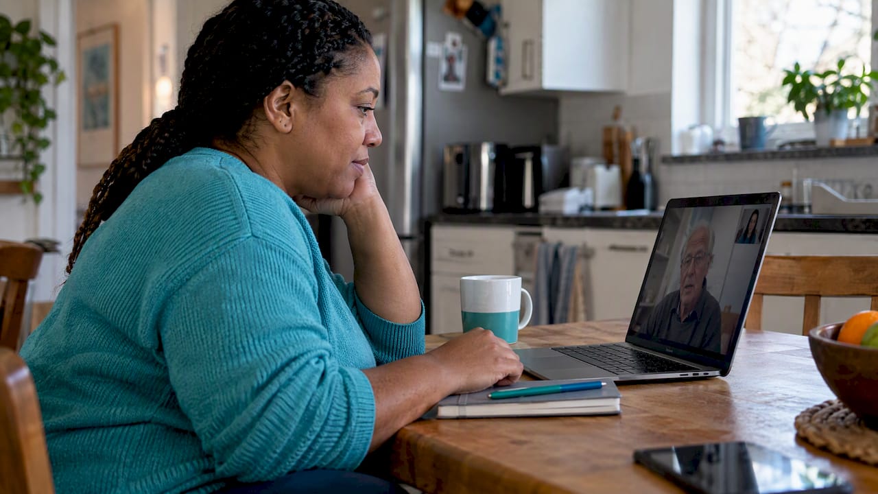 Family conducting a long distance caregiving meeting